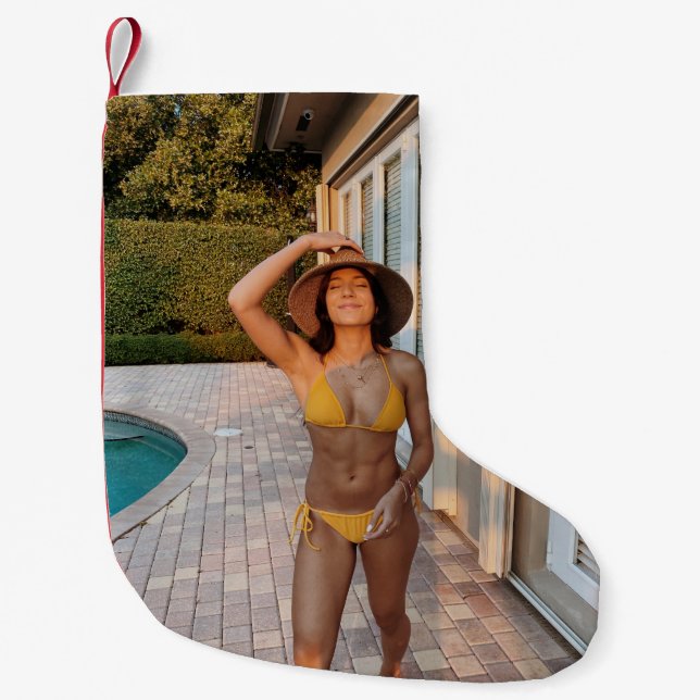 Woman in yellow bikini standing on brown brick flo small christmas stocking (Front)