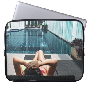 Woman laying on brown chaise lounge laptop sleeve