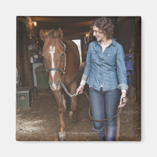 Woman leading horse magnet
