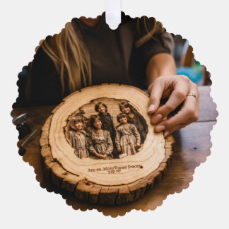 woman looking down at an engraving of her kids on  tree decoration card