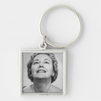 Woman Looking Up Key Ring
