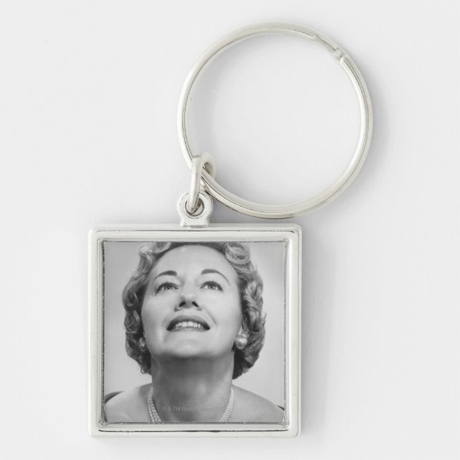 Woman Looking Up Key Ring (Front)