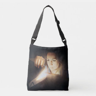 Woman Looks Inside a Glowing Book Crossbody Bag