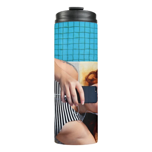 Woman lying on brown floor thermal tumbler (Front)