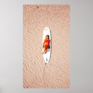 Woman lying on the surfboard poster