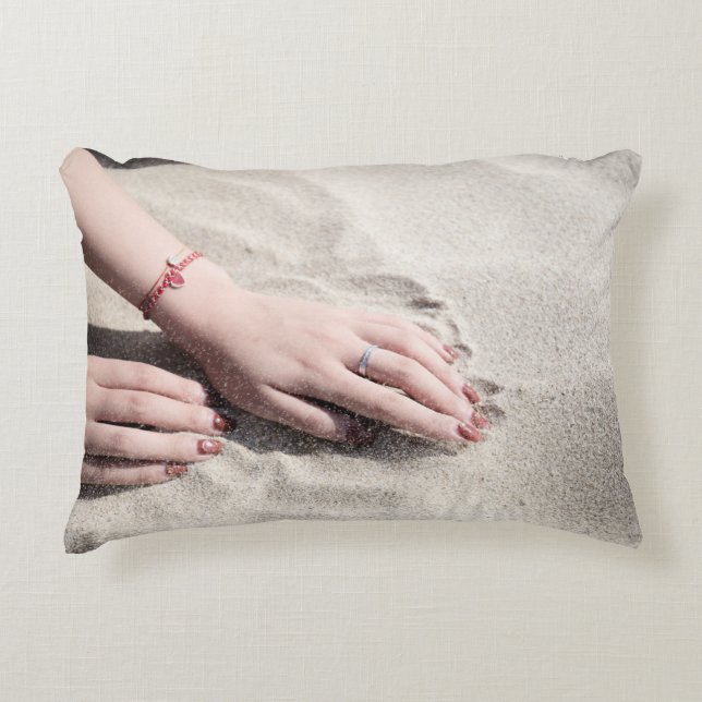 Woman lying on white sand decorative cushion (Front)