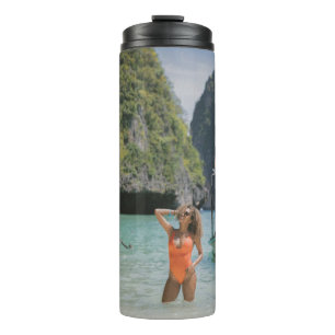 Woman on body of water between brown boats thermal tumbler