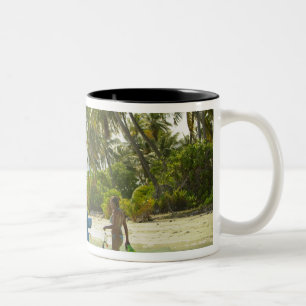 Woman on small traditional fishing boat, Two-Tone coffee mug