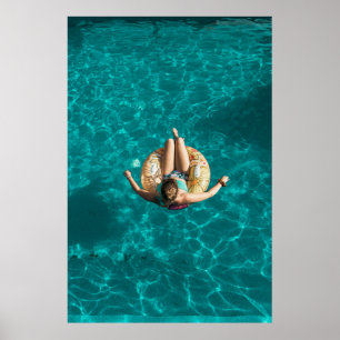 Woman on yellow inflatable floater poster