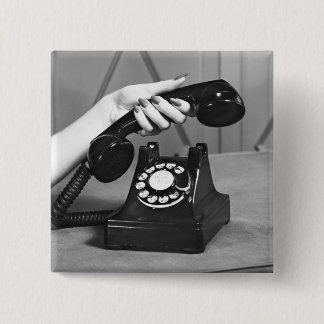 Woman picking up phone close up of hand 15 cm square badge