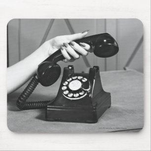 Woman picking up phone close up of hand mouse mat