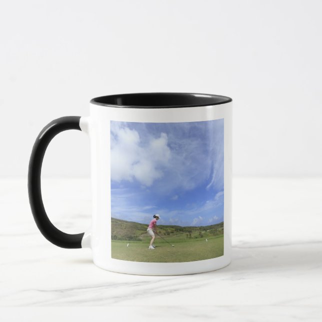 Woman playing golf mug (Left)
