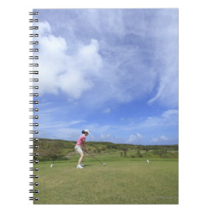 Woman playing golf notebook