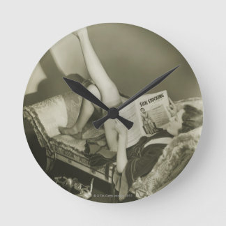 Woman Reading Magazine Round Clock