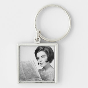 Woman Reading Newpaper Key Ring