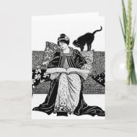 Woman reading with a black cat
