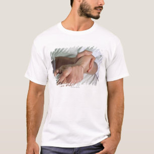 Woman receiving foot massage 2 T-Shirt