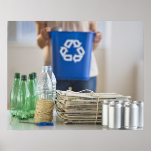 Woman recycling plastic bottles, cans and poster