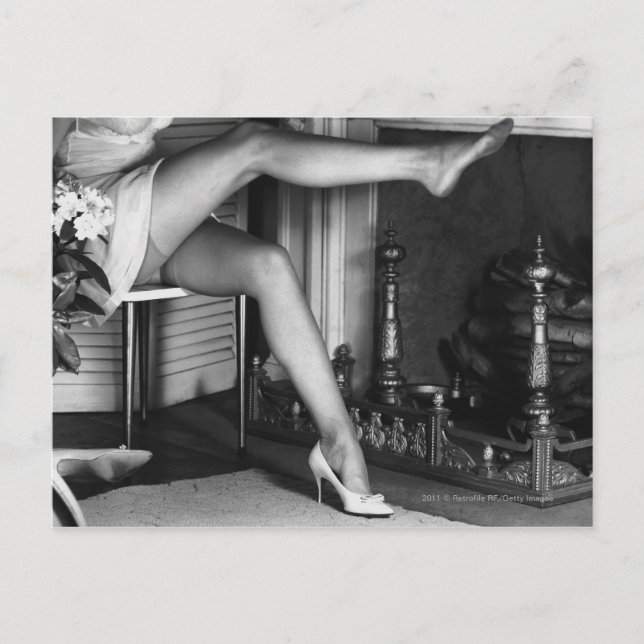 Woman sitting by fireplace B&W Postcard (Front)