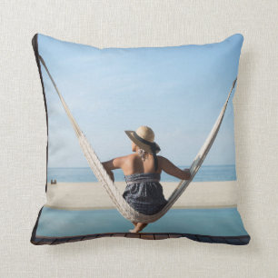 Woman Sitting On A Hammock At A Small Hotel Cushion
