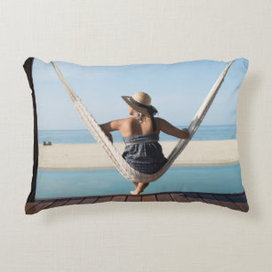 Woman Sitting On A Hammock At A Small Hotel Decorative Cushion
