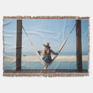 Woman Sitting On A Hammock At A Small Hotel Throw Blanket