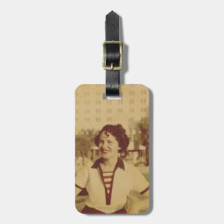 Woman Sitting Outside Luggage Tag