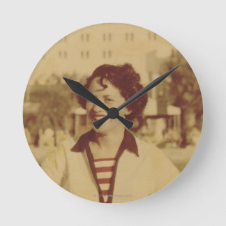 Woman Sitting Outside Round Clock
