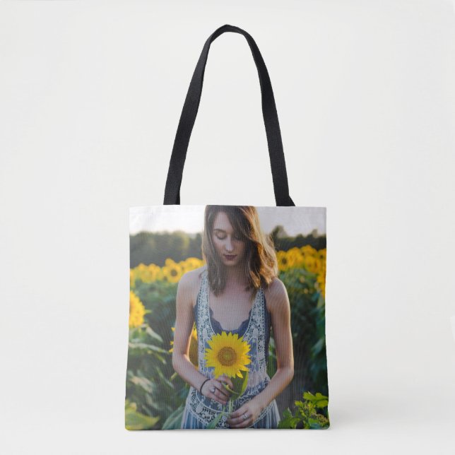 Woman standing at sunflower field tote bag (Front)