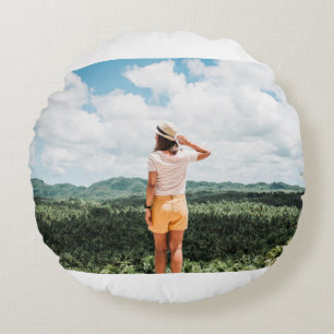 Woman standing near trees round cushion