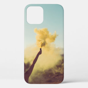 Woman standing on desert holding flare iPhone 12 case