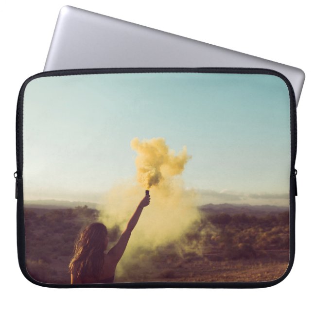 Woman standing on desert holding flare laptop sleeve (Front)