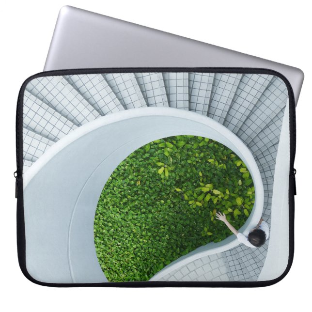 Woman standing spiral stairs laptop sleeve (Front)