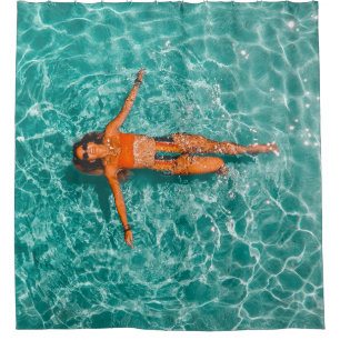Woman swimming alone in body of water shower curtain
