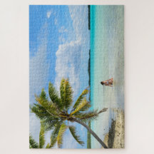 Woman under a palm tree in the Pacific