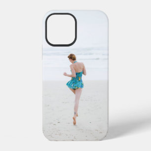 Woman walking on shore near beach iPhone 12 case