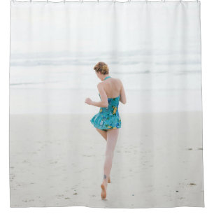 Woman walking on shore near beach shower curtain