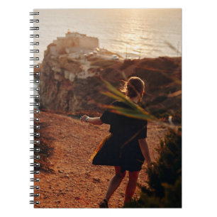 Woman walking on stone notebook