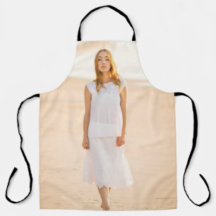 Woman walking on the shore apron