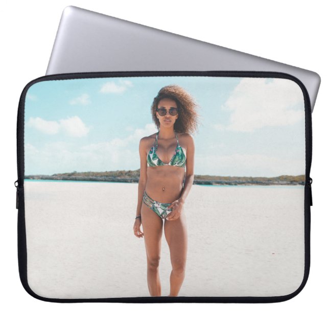 Woman wearing bikini standing on sand laptop sleeve (Front)