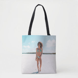 Woman wearing bikini standing on sand tote bag