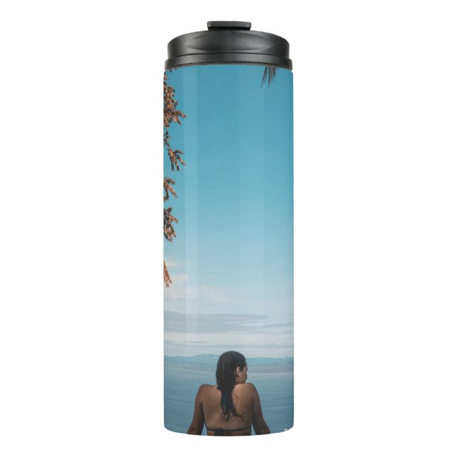 Woman wearing black bikini tap swimming on body of thermal tumbler (Front)