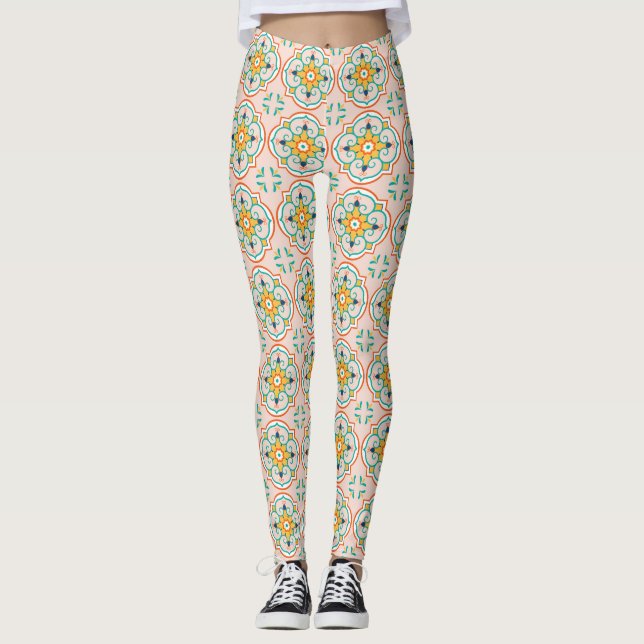 Woman wearing leggings with a floral tile pattern (Front)