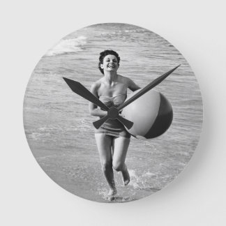 Woman with a Beach Ball Round Clock