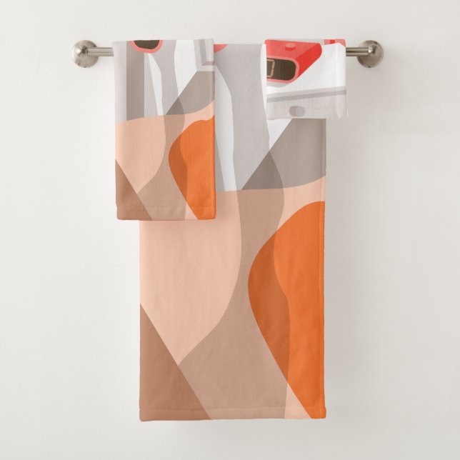 Womans hand pushing on alarm clock snooze button bath towel set (Insitu)