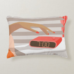 Womans hand pushing on alarm clock snooze button decorative cushion