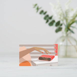 Womans hand pushing on alarm clock snooze button enclosure card