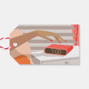 Womans hand pushing on alarm clock snooze button gift tags
