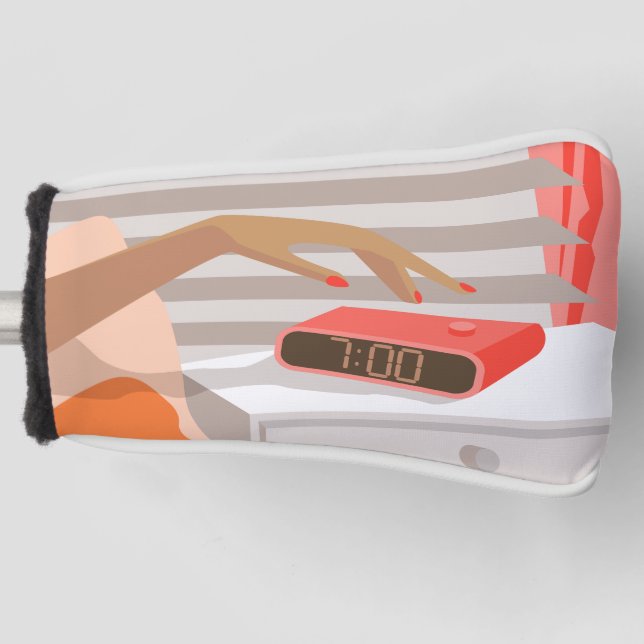 Womans hand pushing on alarm clock snooze button golf head cover (Front)