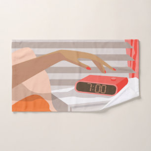 Womans hand pushing on alarm clock snooze button hand towel